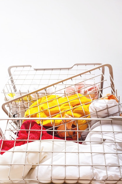 Pile of dirty colorful laundry in baskets