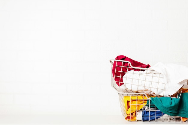 Pile of dirty colorful laundry in baskets