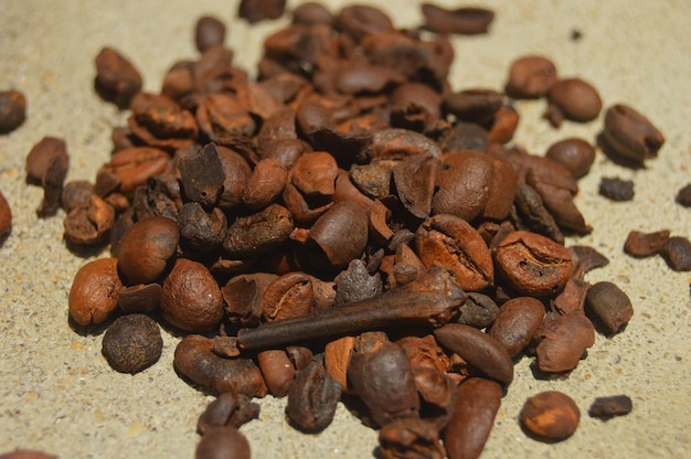 pile of dry coffee beans on a cement floor background