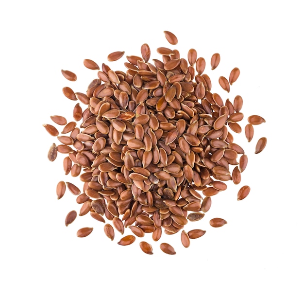 Pile of flax seeds on white , top view