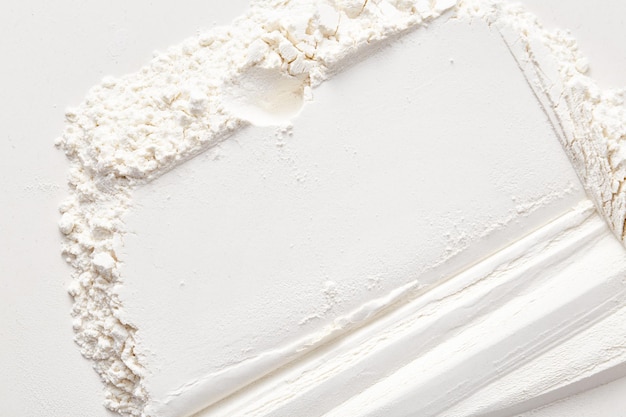 A pile of flour on a white background Flour texture