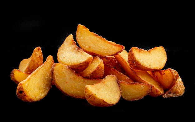 Pile of french fries over black background