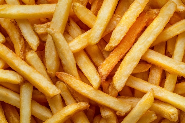 Photo a pile of french fries with one that has the word french on it