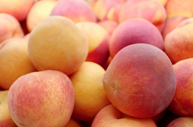 Pile of Fresh Ripe Peaches For Sale on the Market