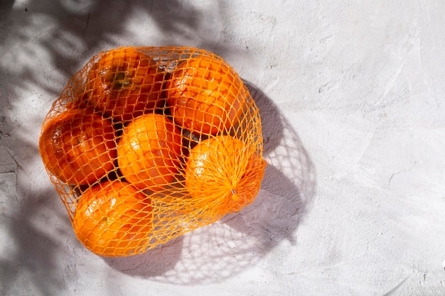 Pile of fresh tangerines on the concrete table