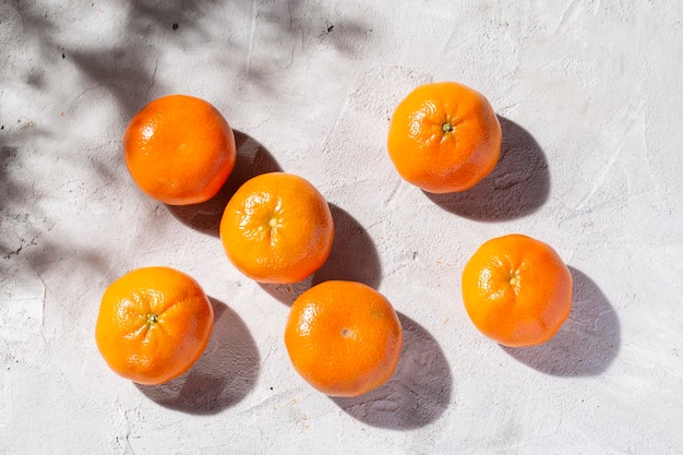 Pile of fresh tangerines on the concrete table