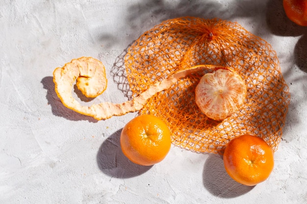 Pile of fresh tangerines on the concrete table