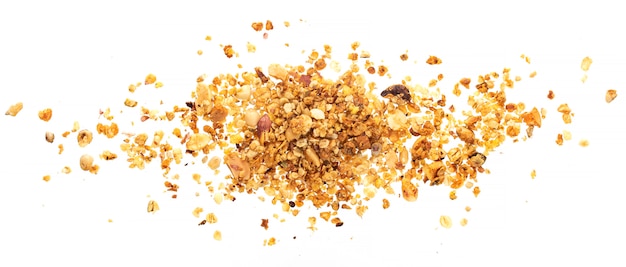 Pile of granola with nuts on white surface