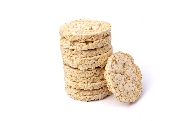 Pile of healthy puffed rice cakes isolated on white background