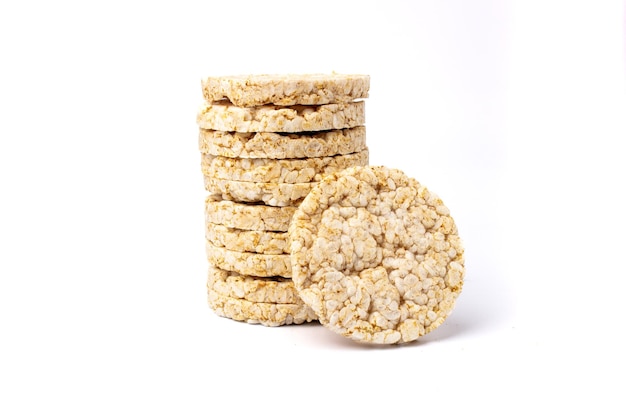 Pile of healthy puffed rice cakes isolated on white background