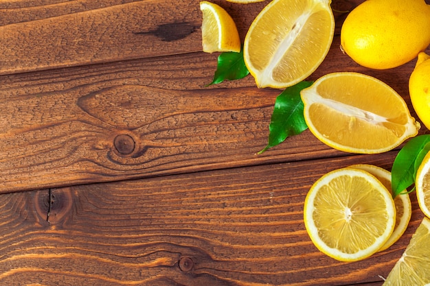 Pile of lemons on wooden table