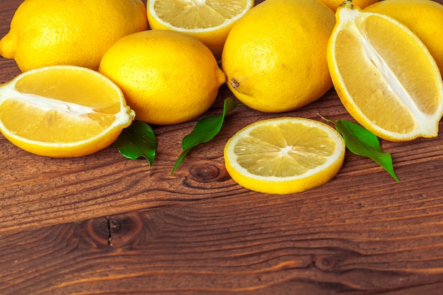 Pile of lemons on wooden table