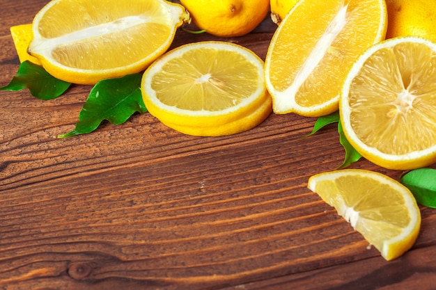 Pile of lemons on wooden table