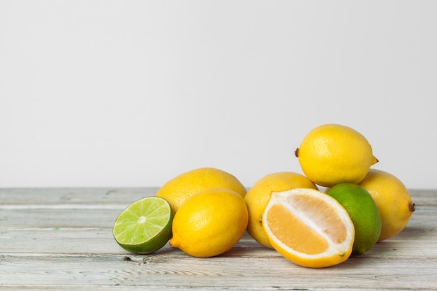 Pile of lemons on wooden table