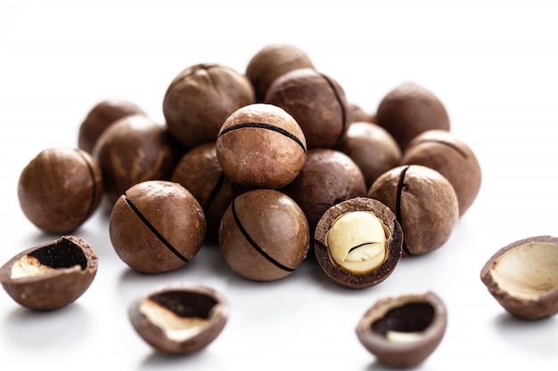 Pile of macadamia nuts isolated on white