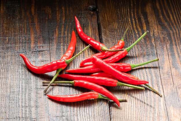 Pile of Mexican chili peppers on wooden table