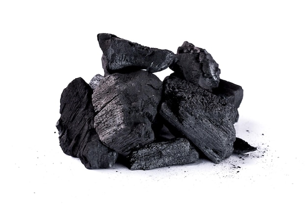 Pile of natural wood charcoal Isolated on white background. activated carbon.