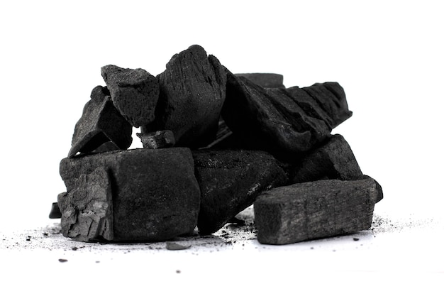 Photo pile of natural wood charcoal isolated on white background.