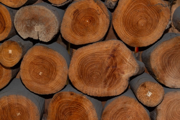 Pile of natural wooden timber construction material.Wooden texture background.