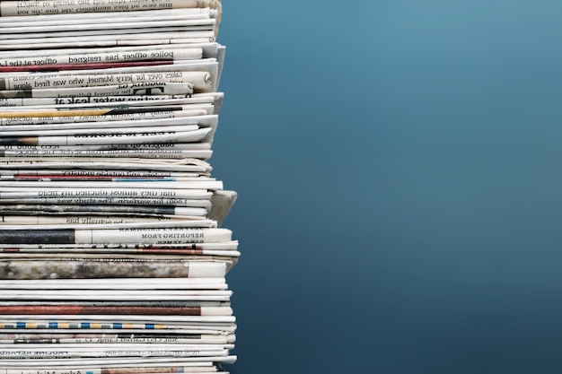 Pile of newspapers on background