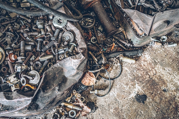 A pile of old metallic nut and bolt