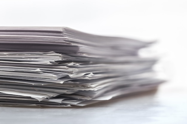 Pile of paper documents on background, close up