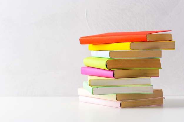  pile of paperback books on a table