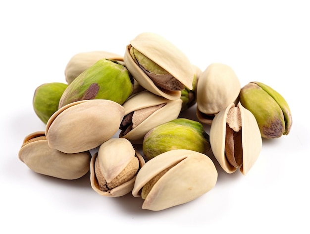 A pile of pistachios on a white background