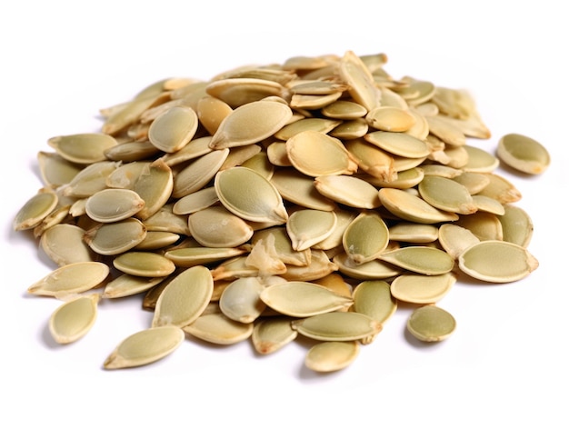 A pile of pumpkin seeds on a white background