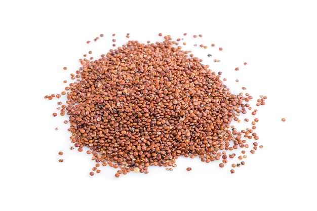 Pile of raw red quinoa isolated on white surface