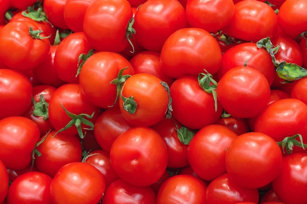 A pile of red tomatoes as background texture