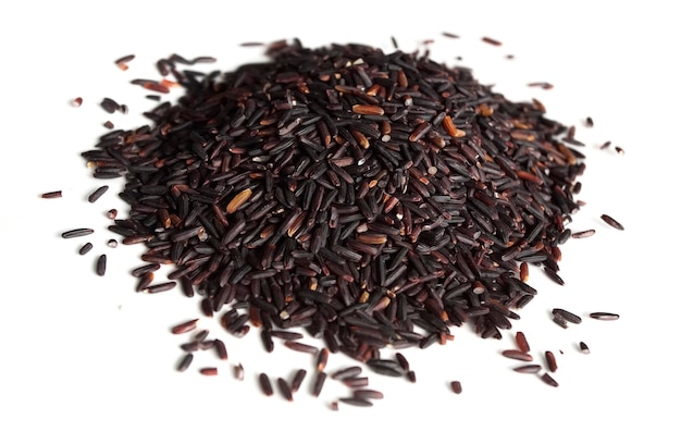 Pile of riceberry isolated on a white background Riceberry is rich in nutrients has good antioxidant properties and has many health benefits Riceberry is slender glossy dark purple rice