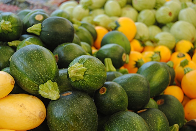 Pile of round zucchini in a farmers market