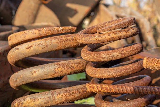 A pile of rusted metal parts with the word rust on the top.