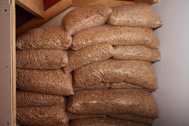 A pile of sacks full of wood pellets