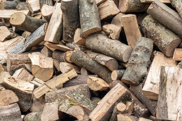 A pile of sawed firewood for heating in winter Stockpile of firewood during the energy crisis