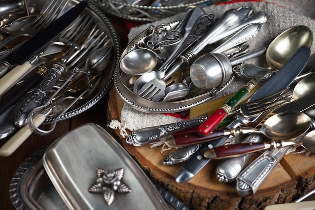 A pile of silverware with a star on the top.