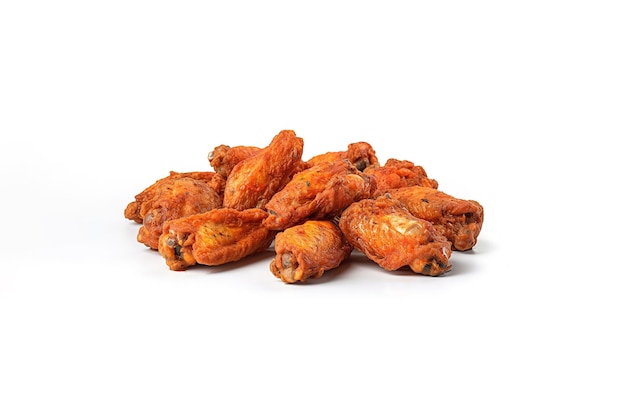 a pile of spicy fried chicken wings isolated on a white background