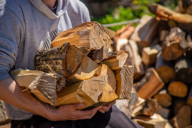 A pile of stacked firewood, prepared for heating the house