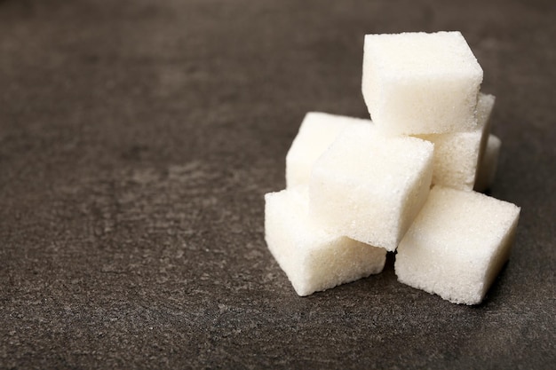 Pile of sugar cubes on the table