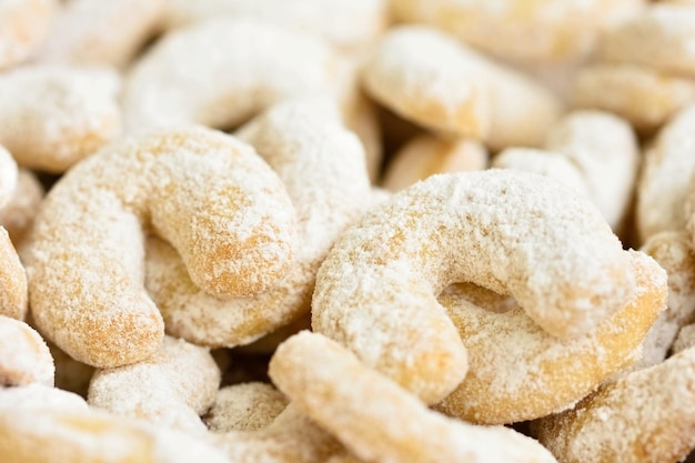 A pile of sugary cookies with the word almonds on the top.