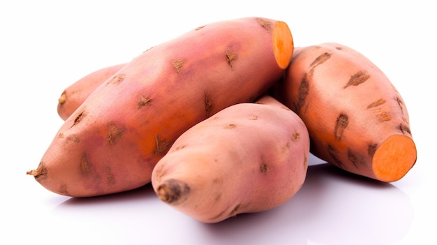 A pile of sweet potatoes on a white background