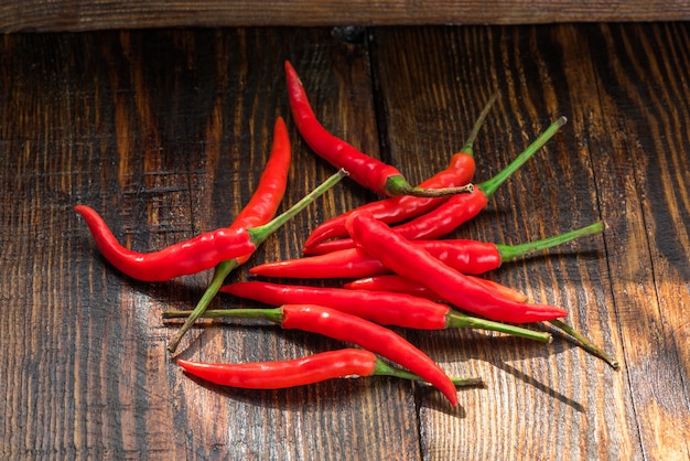 Pile of thai chilis on a old wooden table