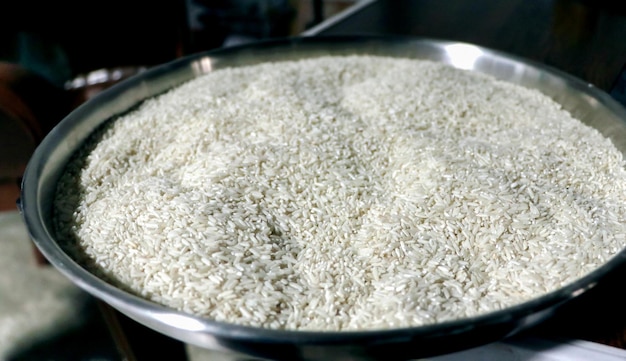 Pile of uncooked rice on a plate