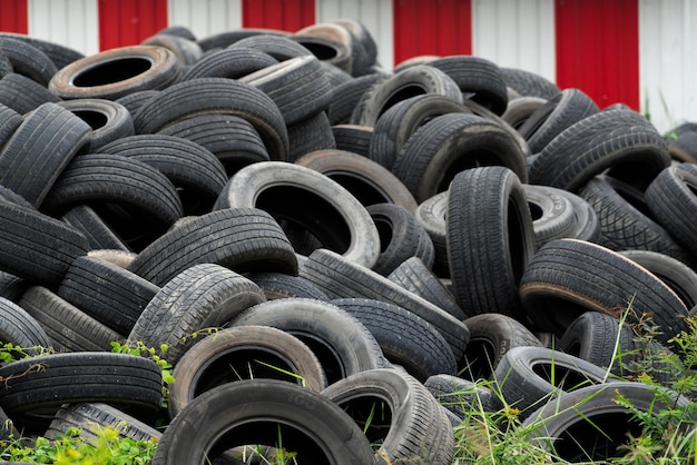 Pile of used tires Old tyres waste for recycle or for landfill Black rubber tire of car Pile tires