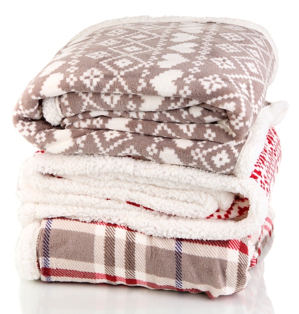 Pile warm plaids isolated on white surface