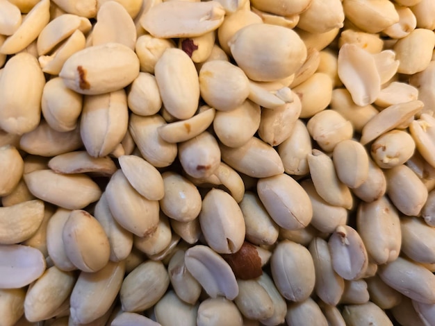 a pile of white cashews with one that has the word pistachio on it