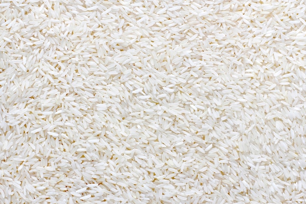 Pile of white rice for background and texture. Stack of Natural rice show Vegetarian, Culture life, Health food, Save environment, Earth day, Rice for life, Food ingredient concept.