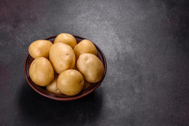 A pile of young potatoes on the table The benefits of vegetables