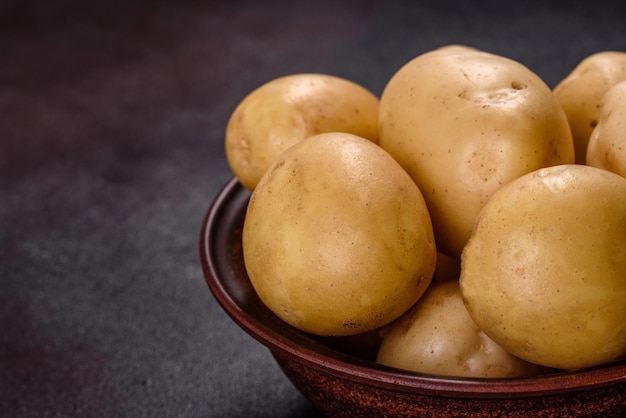 A pile of young potatoes on the table The benefits of vegetables